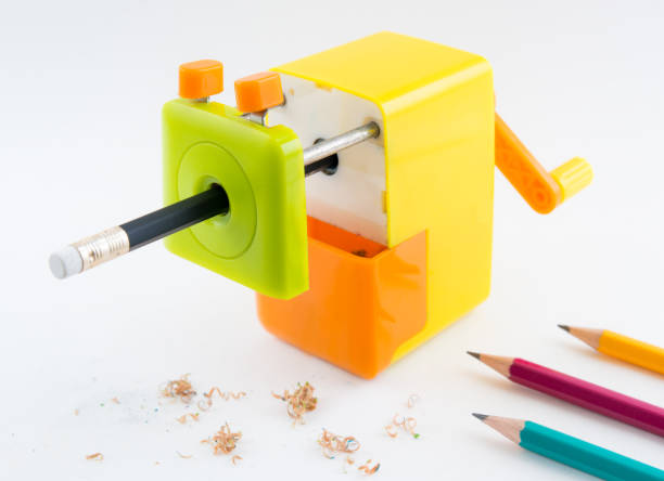 istock colorful rotary pencil sharpener with pencil, on white background 1030188408