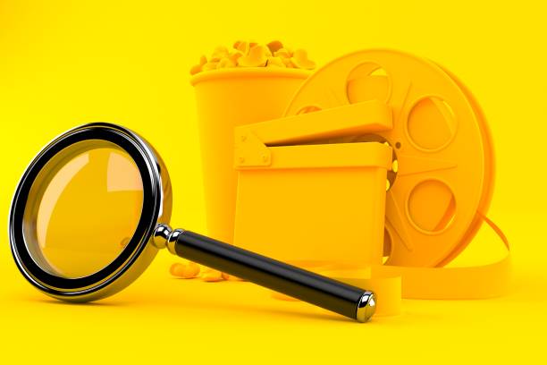 istock Cinema background with magnifying glass 1030188874