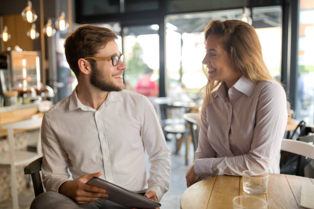 istock Business people talking and laughing together 1030191048