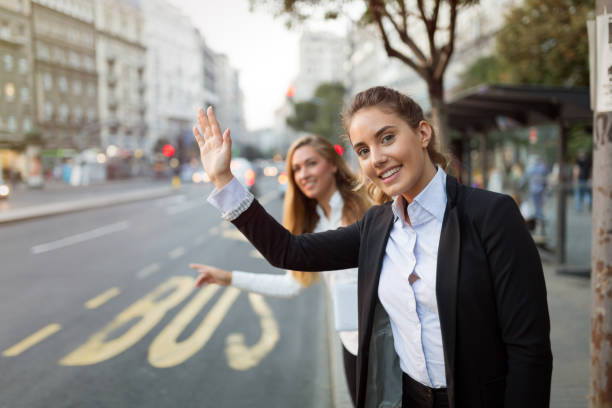 istock Businesswoman waving for a cab 1030191826