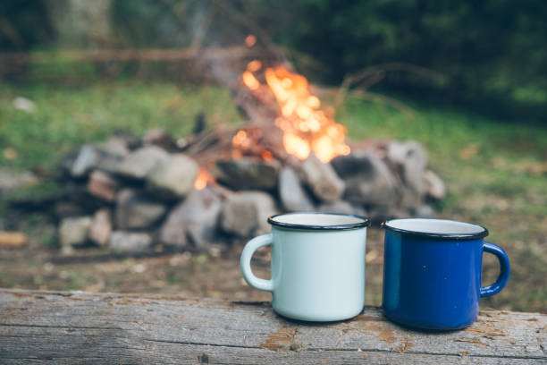 istock two metal cups with tea. fire on background 1030195808