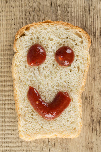 istock Slice of bread with a smile 1030199492