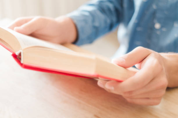 istock Teenager reading a book 1030199508