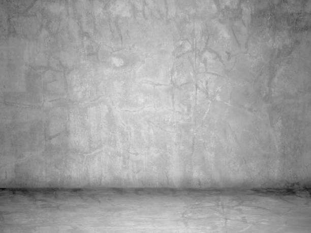 istock Dark room concrete wall background. interior concrete texture  wall and floor 1030199770