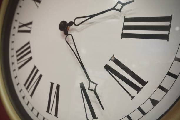 istock time show on big vintage clock 1030202314