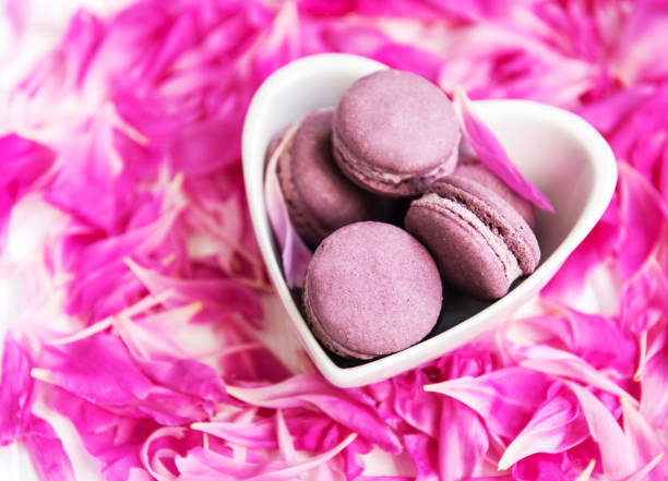 istock Pink peony petals with macarons 1030222170