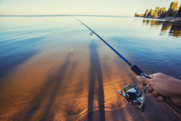 istock Fishing with rod on lake 1030228742
