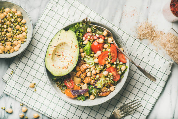 istock Vegan dinner bowl with avocado, grains, beans and vegetables 1030228948