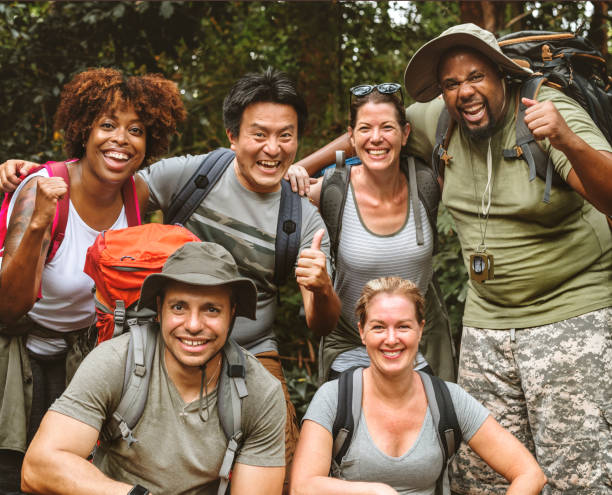 istock Group of diverse friends trekking together 1030235092