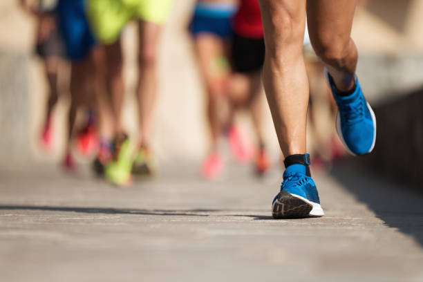 マラソン走るレース - marathon running group of people jogging ストックフォトと画像