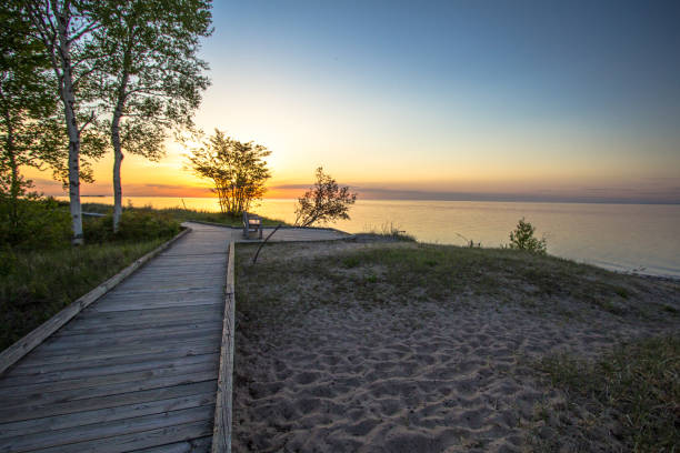 istock Boardwalk Sunset On Sandy Lake Superior Beach 1030239930