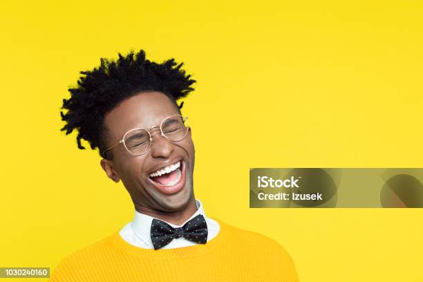 Funny Portrait Of Nerdy Young Man Laughing With Eyes Closed Stock Photo - Download Image Now