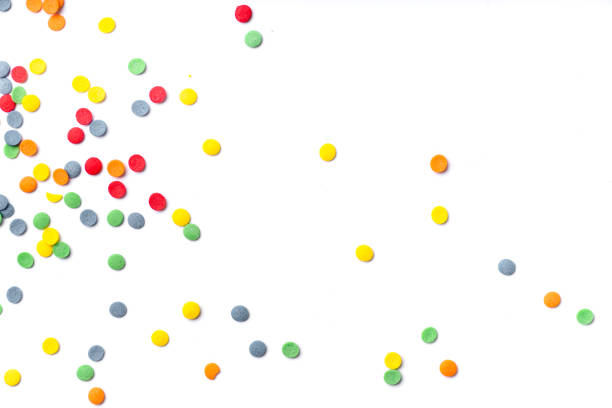 istock Colorful sweet confetti topping on white background with copy space 1030242896