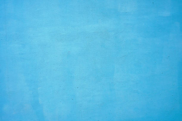 istock Background with concrete wall painted in blue 1030243140