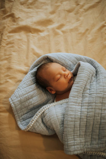 istock Infant baby fast asleep on the bed 1030243456