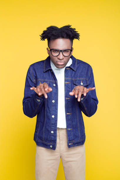 istock 80's style portrait of confident nerdy young man 1030243722