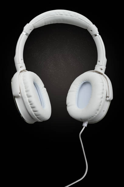 istock Modern white headphone on black background close up 1030250344