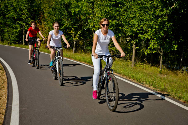 istock Urban biking- three people riding bikes in city 1030253806