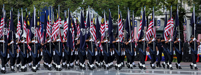 PUTRAJAYA, MALAYSIA - AUGUST 31, 2018 : Participant carry Jalur Gemilang flag during National Day celebration parade in Putrajaya. Celebrating the 61th anniversary of independence or Merdeka Day.