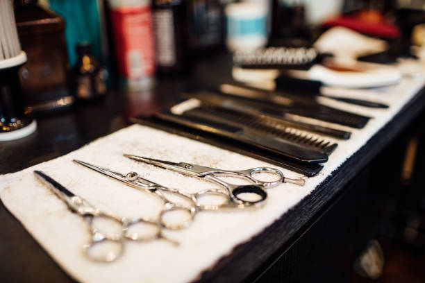Scissors and combs on napkin in barbershop