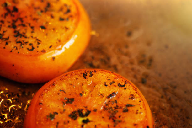 istock Tomatoes seasoned with basil and pepper cooking in pan 1030254818