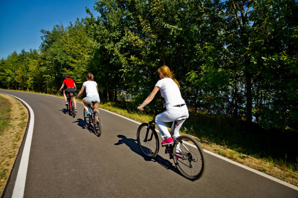 istock Urban biking- three people riding bikes in city 1030258164