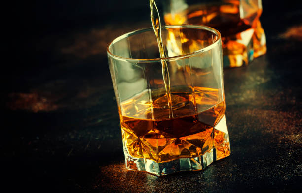 istock Bourbon in glass, american corn whiskey 1030258428