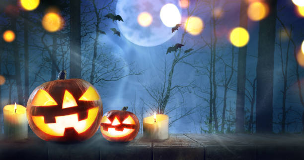 istock Halloween pumpkins in forest 1030267542