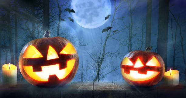 istock Halloween pumpkins in forest 1030267550