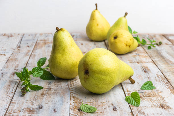 istock Fresh organic pears on old wood. Fruit background. Pear autumn harvest 1030270126