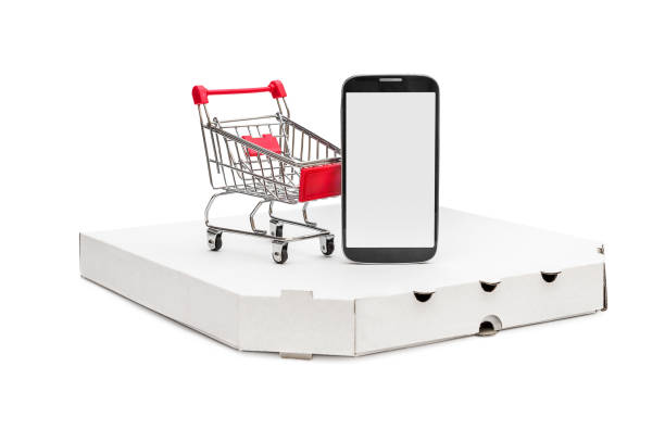 istock Shopping cart, blank smartphone and pizza box on white. 1030270526
