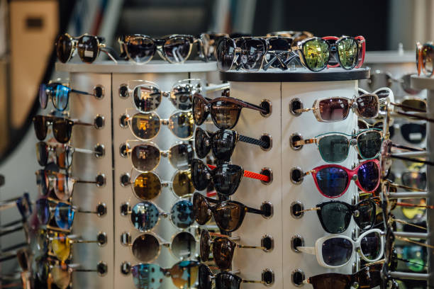 istock Different fashion multicolored sunglasses on the store counter 1030272664