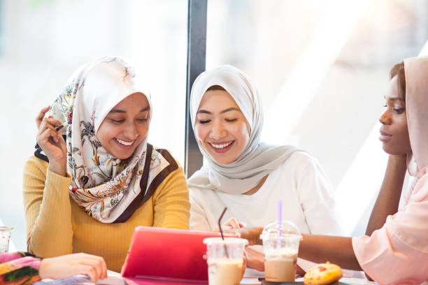 istock Three college students in hijab are studying using the tablet 1030273486