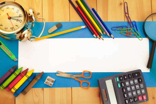 istock School stationery on wooden background,copy space 1030280242