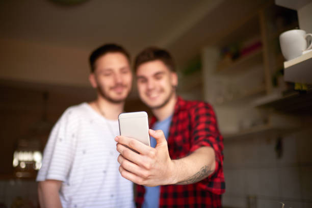 istock Gay couple taking a selfie image 1030281432