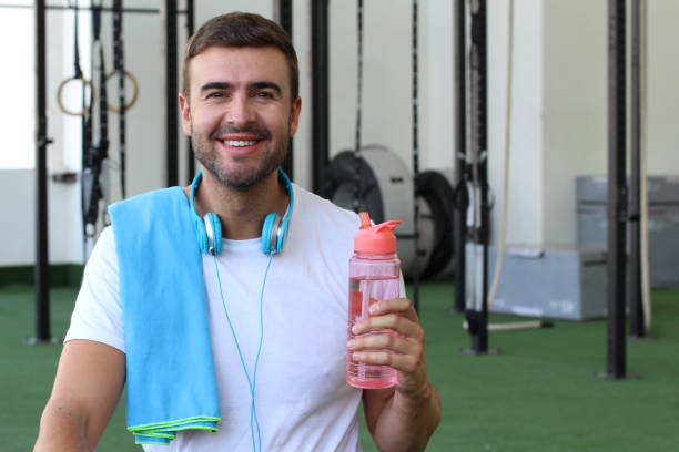 istock Male drinking water at the gym 1030281492