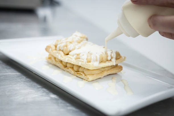istock Dessert elaboration and plating on a restaurant kitchen. 1030288268