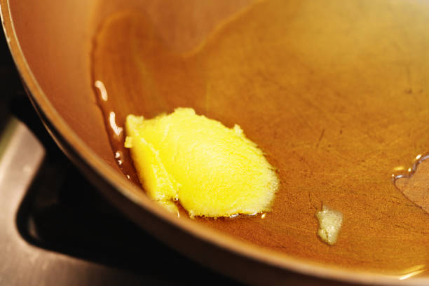 istock Ghee - or clarified butter - melting in a pan 1030291432