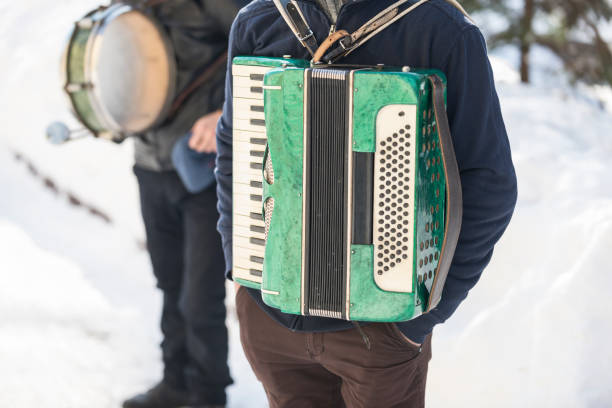 istock gypsies with accordion in winter 1030298436