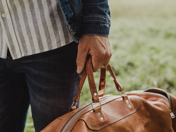 istock Man carrying luggage suitcase ready for trip 1030299442