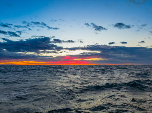 istock Bright colorful crimson sunset in the open sea 1030306314