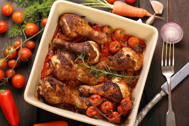 istock Roasted chicken legs on the ceramic bowl cooked with vegetables 1030306778