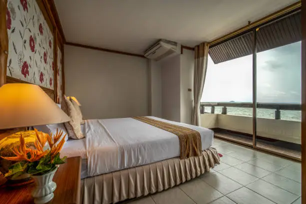 interia perspective of king size bed room in executive suite hotel bedroom at Rayong Chalet Rayong district Thailand