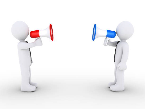 istock Opposing businessmen with megaphones 1030311126