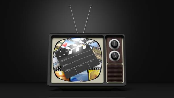 istock Antique TV set with film clap on screen, on black background. 3D rendering 1030314908