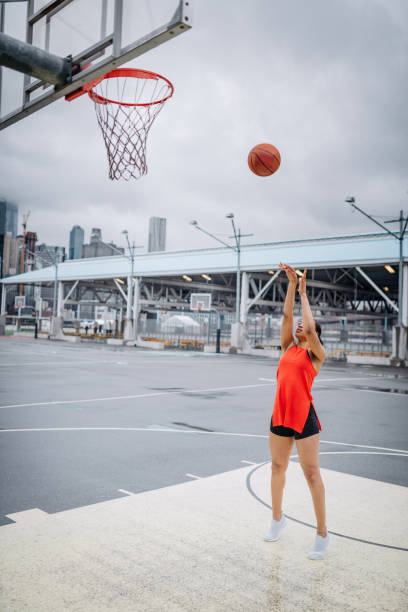 istock Young female outstanding basketball player 1030315778