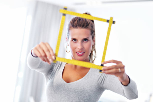 istock Mature woman doing home improvements 1030315940