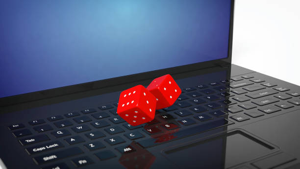 istock 3D rendering of  two red dices on laptop's keyboard 1030319694