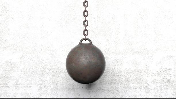 istock Metallic rusty wrecking ball on chain. 3D rendering 1030319750