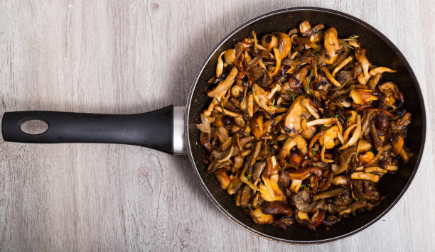 istock Delicious freshly cooked fried shitake mushrooms in a frying pan 1030322538